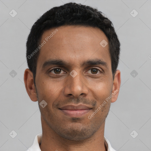 Joyful latino young-adult male with short  black hair and brown eyes