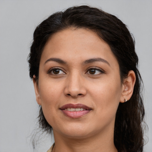 Joyful white young-adult female with medium  brown hair and brown eyes