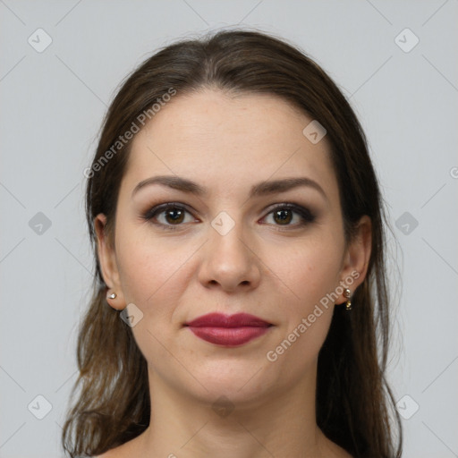 Joyful white young-adult female with long  brown hair and brown eyes