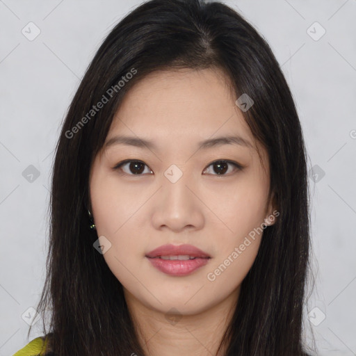 Joyful asian young-adult female with long  brown hair and brown eyes