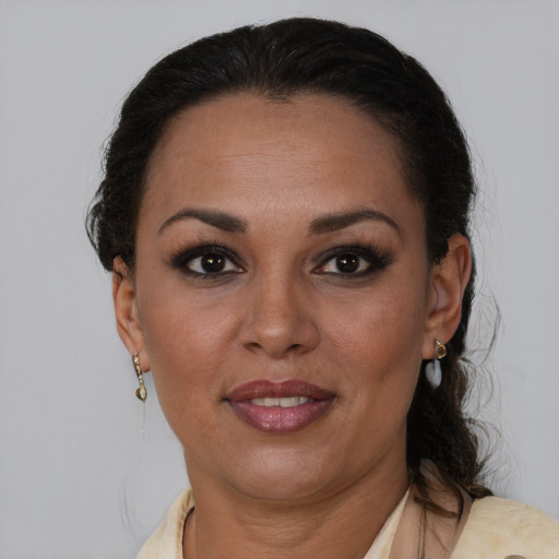 Joyful latino adult female with short  brown hair and brown eyes