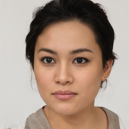 Neutral asian young-adult female with medium  brown hair and brown eyes