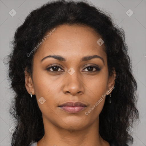 Joyful black young-adult female with long  brown hair and brown eyes