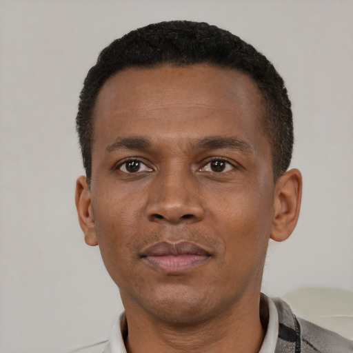Neutral black young-adult male with short  black hair and brown eyes
