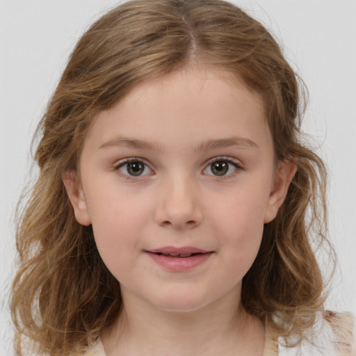 Joyful white child female with medium  brown hair and brown eyes