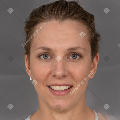 Joyful white adult female with short  brown hair and grey eyes