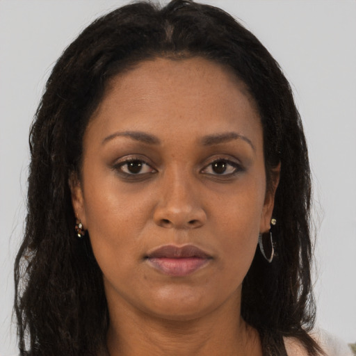 Neutral black adult female with long  brown hair and brown eyes