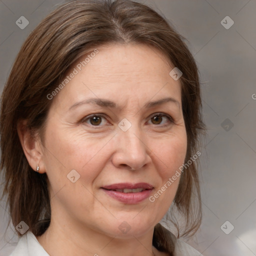 Joyful white adult female with medium  brown hair and brown eyes