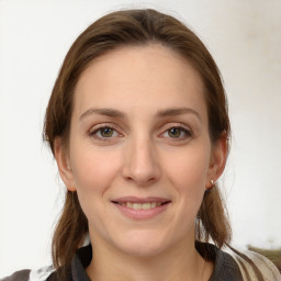 Joyful white young-adult female with medium  brown hair and grey eyes