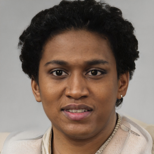 Joyful black young-adult female with short  brown hair and brown eyes