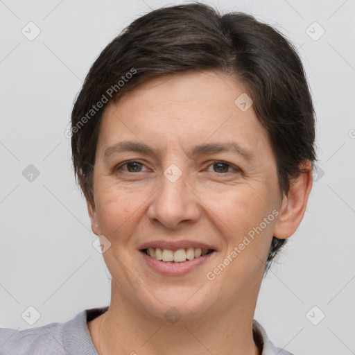 Joyful white adult female with short  brown hair and brown eyes