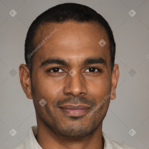 Joyful latino young-adult male with short  brown hair and brown eyes