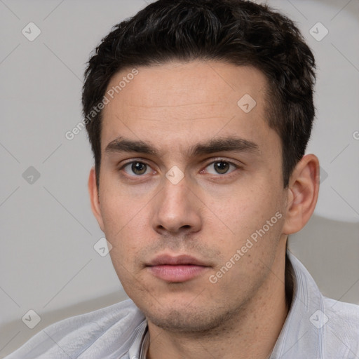 Neutral white young-adult male with short  brown hair and brown eyes