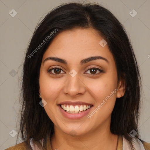 Joyful latino young-adult female with medium  brown hair and brown eyes