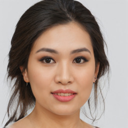 Joyful asian young-adult female with medium  brown hair and brown eyes