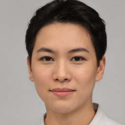 Joyful asian young-adult female with short  black hair and brown eyes