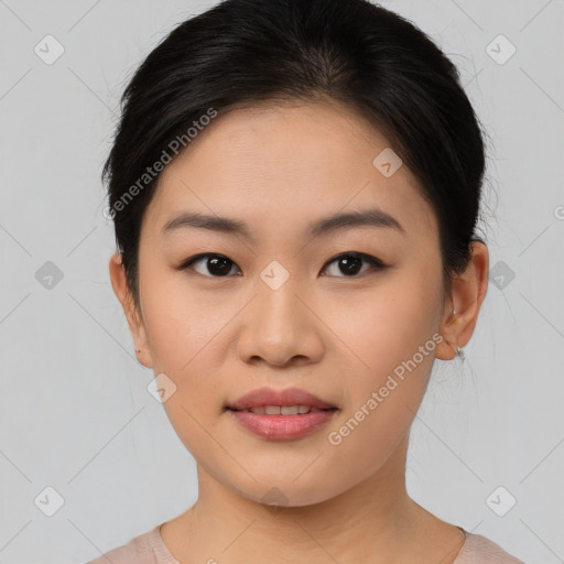 Joyful asian young-adult female with short  brown hair and brown eyes