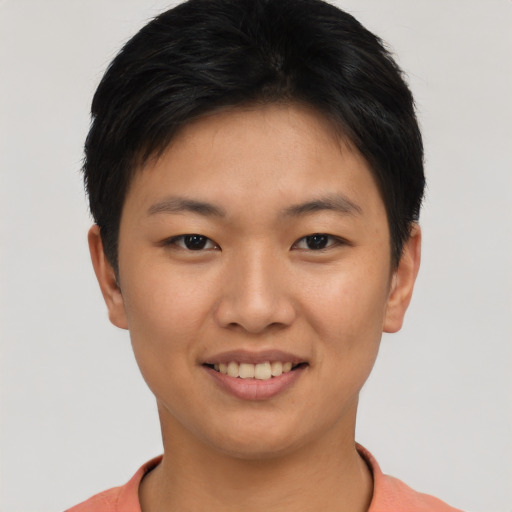 Joyful asian young-adult female with short  black hair and brown eyes