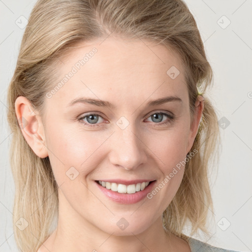 Joyful white young-adult female with medium  brown hair and blue eyes