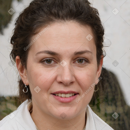 Joyful white adult female with short  brown hair and brown eyes