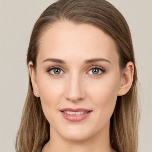 Joyful white young-adult female with long  brown hair and grey eyes