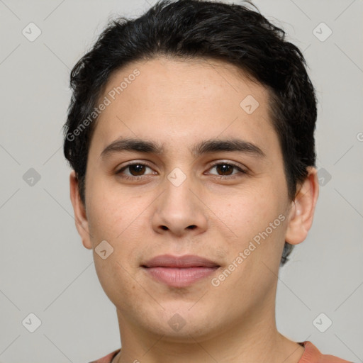 Joyful white young-adult male with short  black hair and brown eyes