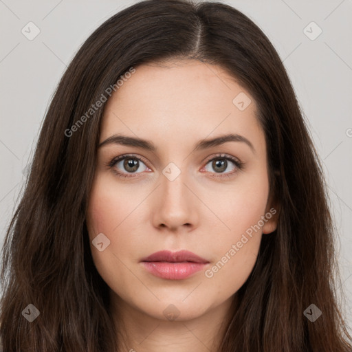 Neutral white young-adult female with long  brown hair and brown eyes