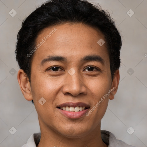 Joyful latino young-adult male with short  black hair and brown eyes