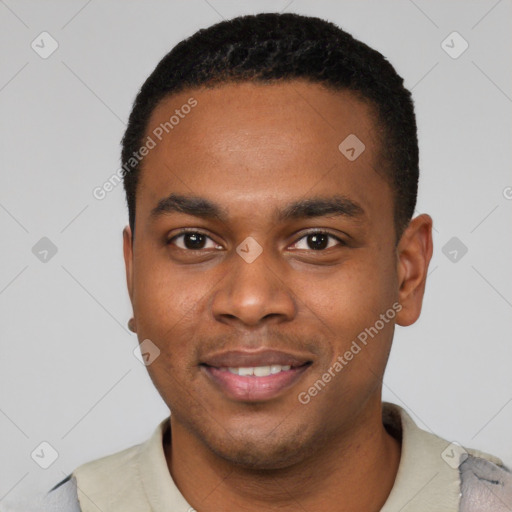 Joyful black young-adult male with short  black hair and brown eyes