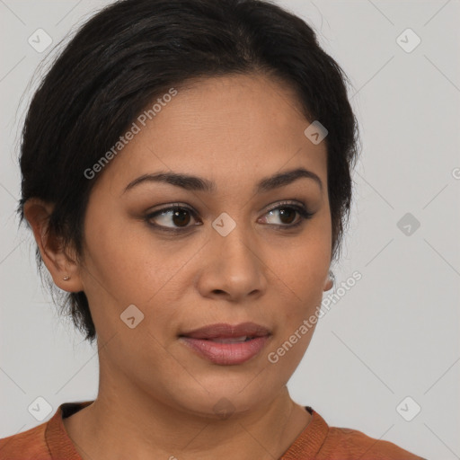 Joyful latino young-adult female with medium  brown hair and brown eyes