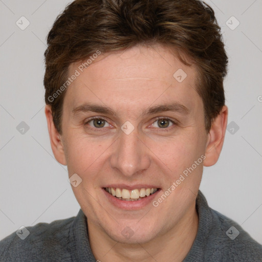 Joyful white adult male with short  brown hair and grey eyes