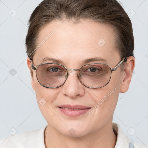 Joyful white adult female with short  brown hair and grey eyes