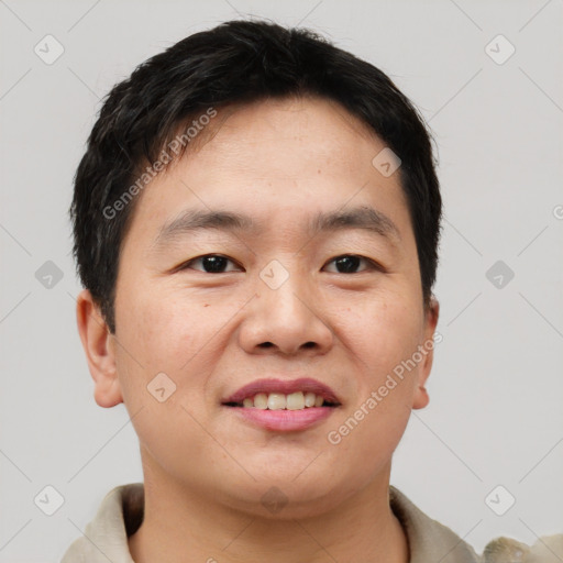 Joyful asian young-adult male with short  brown hair and brown eyes