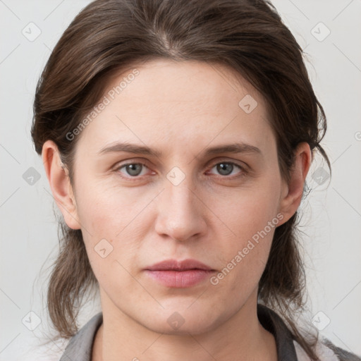 Neutral white young-adult female with medium  brown hair and grey eyes