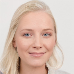 Joyful white young-adult female with long  brown hair and blue eyes