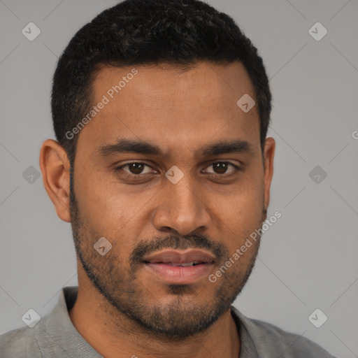 Joyful latino young-adult male with short  brown hair and brown eyes