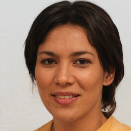 Joyful white adult female with medium  brown hair and brown eyes