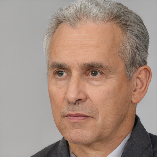 Neutral white middle-aged male with short  gray hair and brown eyes