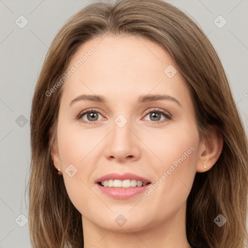 Joyful white young-adult female with long  brown hair and green eyes