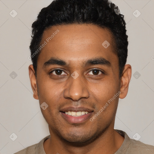 Joyful black young-adult male with short  black hair and brown eyes