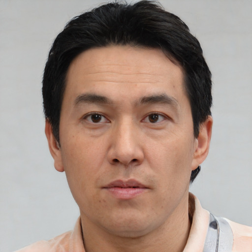 Neutral asian adult male with short  black hair and brown eyes