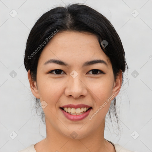 Joyful asian young-adult female with medium  black hair and brown eyes