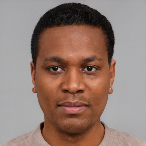 Neutral black young-adult male with short  black hair and brown eyes