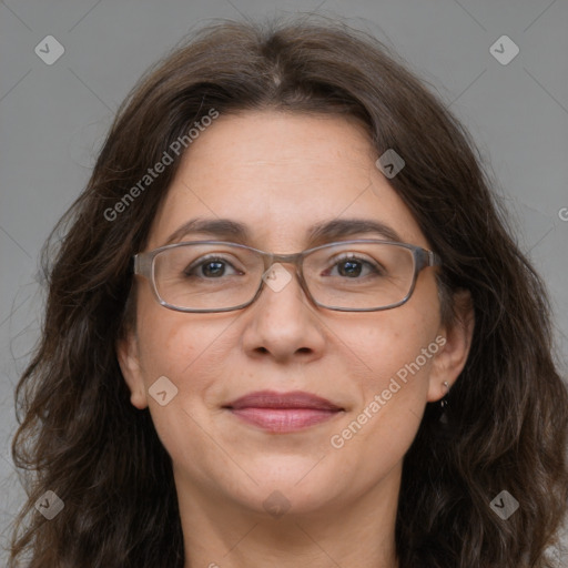 Joyful white adult female with long  brown hair and brown eyes