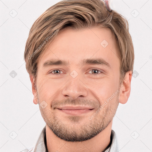 Joyful white young-adult male with short  brown hair and grey eyes