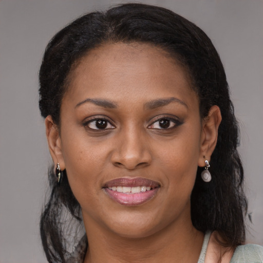 Joyful black young-adult female with medium  brown hair and brown eyes