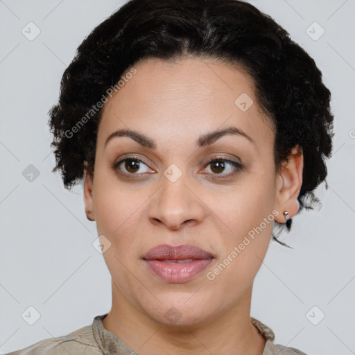 Joyful latino young-adult female with short  black hair and brown eyes