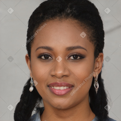 Joyful black young-adult female with long  black hair and brown eyes