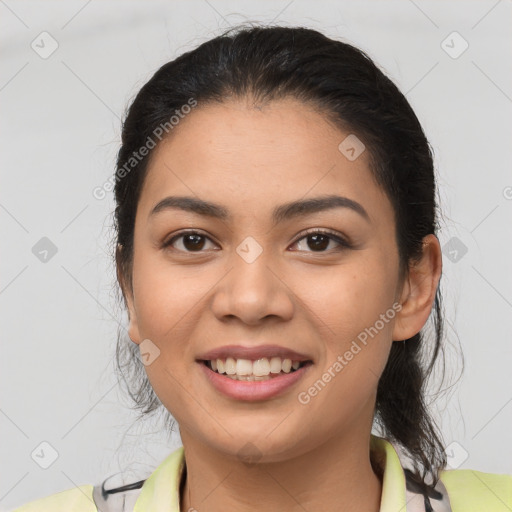 Joyful latino young-adult female with medium  brown hair and brown eyes