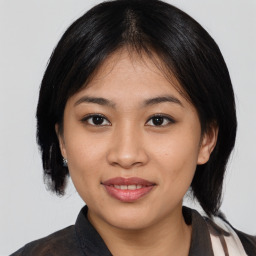 Joyful asian young-adult female with medium  black hair and brown eyes